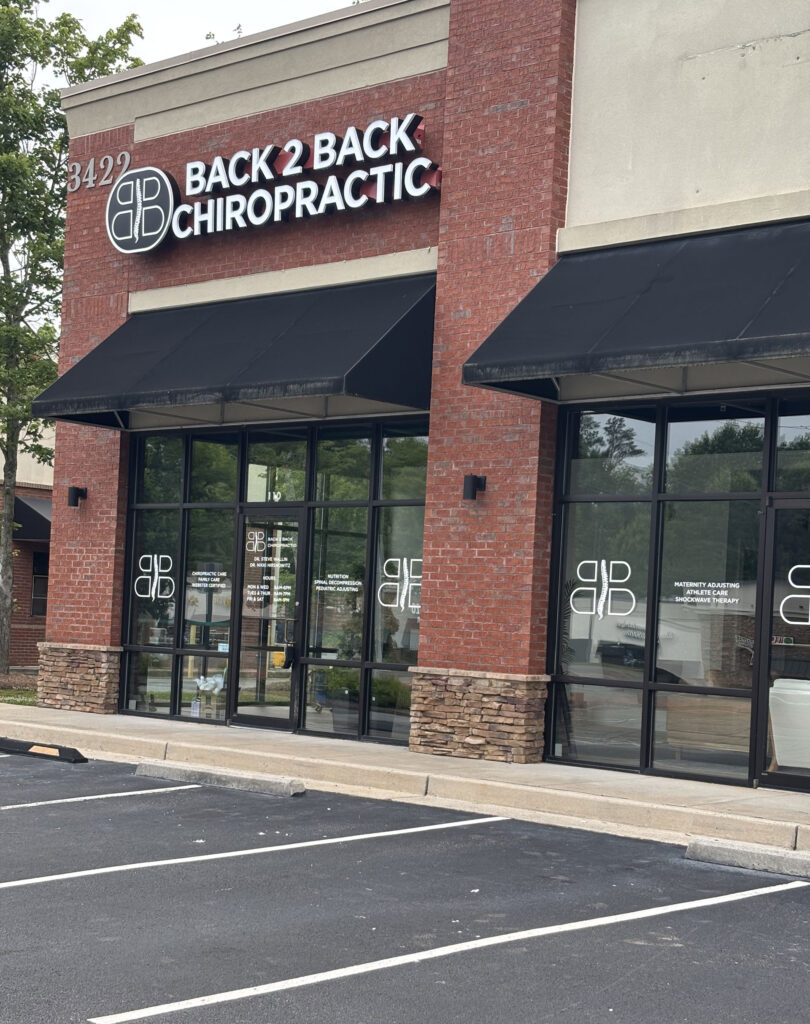 Family receiving personalized chiropractic care near Sixes Road in Canton, Georgia